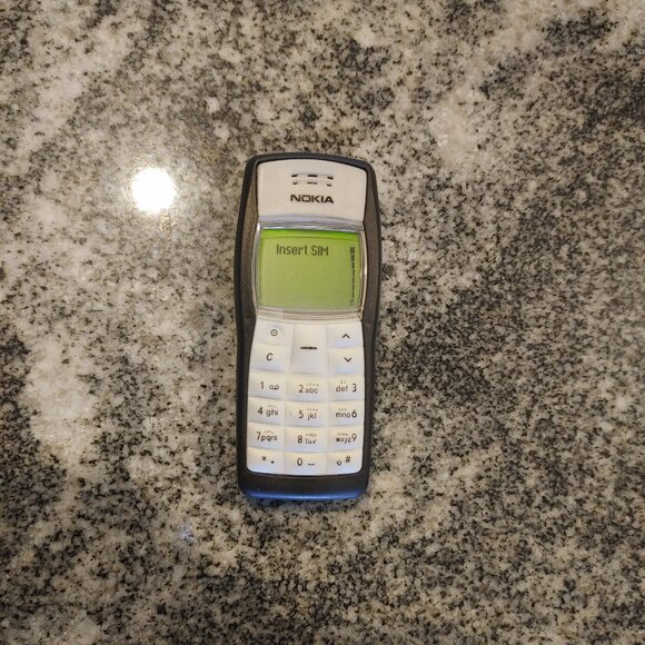Classic Nokia 1100 GSM Phone with charger.